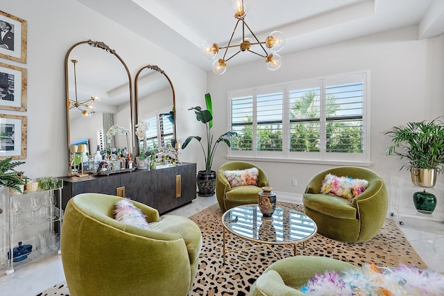 8164 SE Old Plantation Cir, Jupiter, FL 33458 - sitting room featuring a chandelier and a raised ceiling