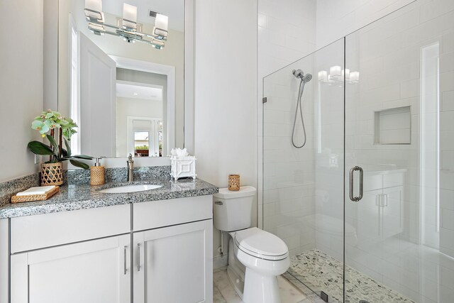 8164 SE Old Plantation Cir, Jupiter, FL 33458 - full bathroom with a stall shower, vanity, and toilet