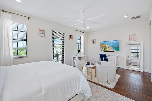 8164 SE Old Plantation Cir, Jupiter, FL 33458 - bedroom featuring dark wood finished floors, multiple windows, recessed lighting, a desk, and baseboards