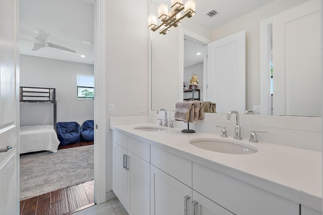 8164 SE Old Plantation Cir, Jupiter, FL 33458 - ensuite bathroom with double vanity, wood finished floors, recessed lighting, and ceiling fan