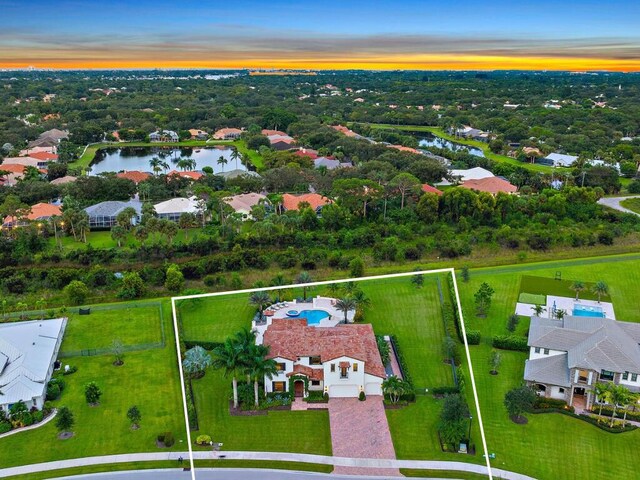 8164 SE Old Plantation Cir, Jupiter, FL 33458 - aerial perspective of suburban area featuring a nearby body of water and property parcel outlined