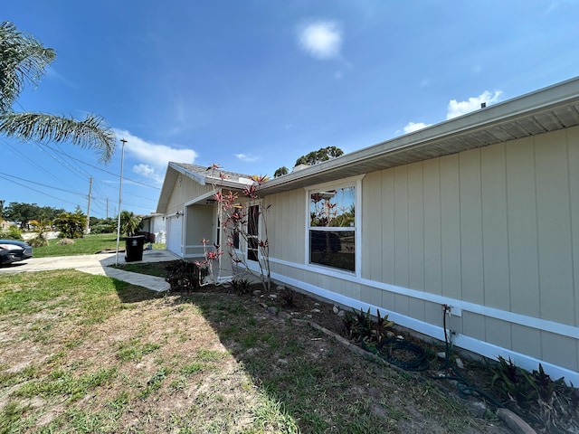 1712 SW Airoso Blvd, Port Saint Lucie, FL 34984 - view of home's exterior featuring driveway and an attached garage