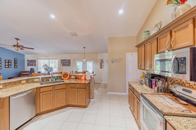 3542 SW Rosardo St, Port Saint Lucie, FL 34953 - kitchen featuring stainless steel appliances, a sink, a ceiling fan, backsplash, and light stone counters