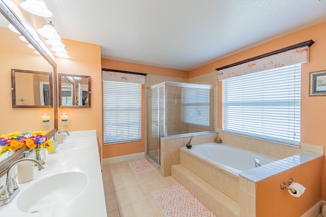 3542 SW Rosardo St, Port Saint Lucie, FL 34953 - bathroom featuring a shower stall, a bath, tile patterned floors, double vanity, and baseboards