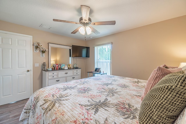 3542 SW Rosardo St, Port Saint Lucie, FL 34953 - bedroom featuring wood finished floors and a ceiling fan