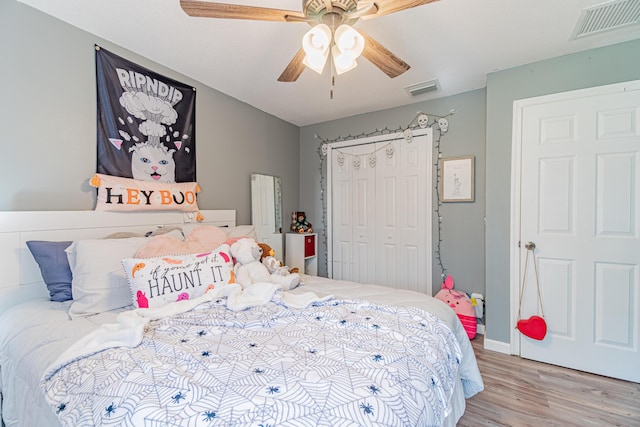 3542 SW Rosardo St, Port Saint Lucie, FL 34953 - bedroom featuring wood finished floors, a closet, a ceiling fan, and baseboards