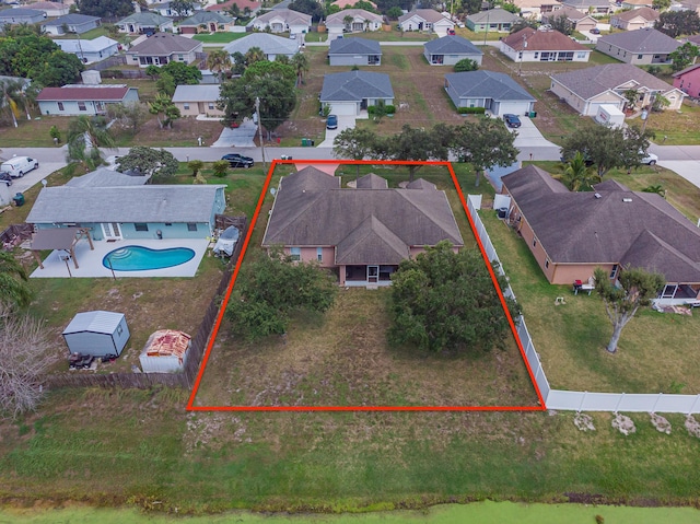 3542 SW Rosardo St, Port Saint Lucie, FL 34953 - aerial view of residential area featuring property parcel outlined and a pool
