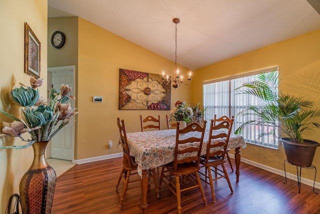 3542 SW Rosardo St, Port Saint Lucie, FL 34953 - dining area with vaulted ceiling, wood finished floors, a chandelier, and baseboards