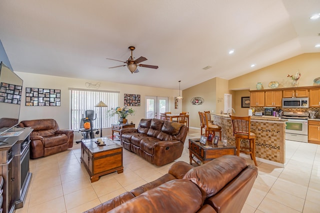 3542 SW Rosardo St, Port Saint Lucie, FL 34953 - living area featuring vaulted ceiling, ceiling fan, light tile patterned floors, and recessed lighting