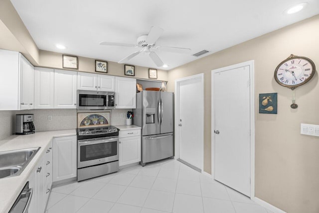 4680 Rosewood Tree Ct Unit A, Boynton Beach, FL 33436 - kitchen with appliances with stainless steel finishes, white cabinets, light countertops, a sink, and recessed lighting