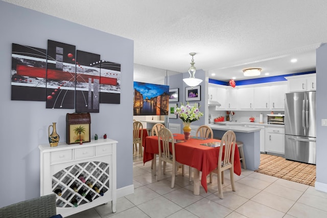 437 Pine Glen Ln Unit B-2, Greenacres, FL 33463 - dining area with a textured ceiling, light tile patterned flooring, and recessed lighting