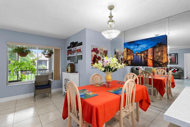 437 Pine Glen Ln Unit B-2, Greenacres, FL 33463 - tiled dining area with baseboards and a textured ceiling