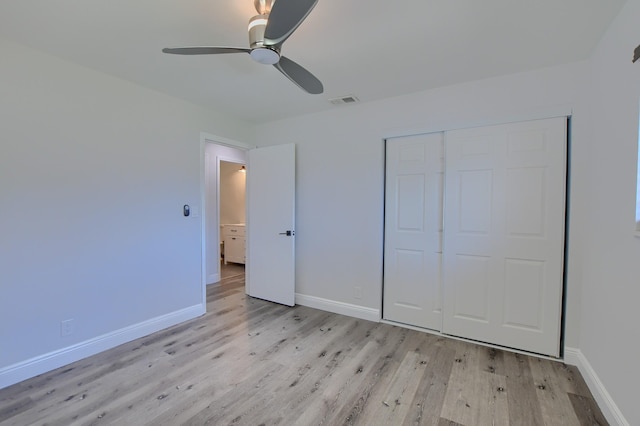 126 NW 3rd Ct, Boca Raton, FL 33432 - unfurnished bedroom featuring light wood-style floors, baseboards, a closet, and ceiling fan