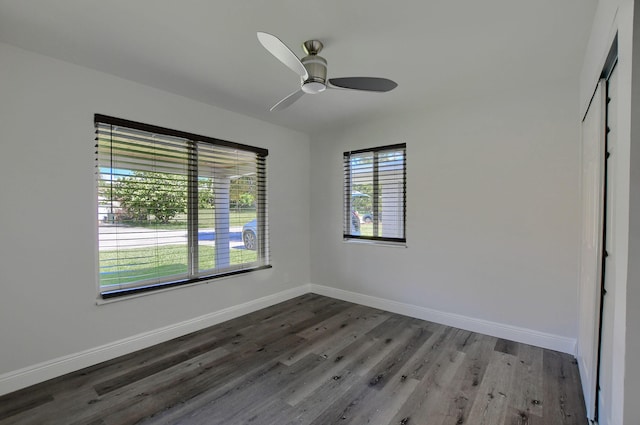 126 NW 3rd Ct, Boca Raton, FL 33432 - spare room featuring baseboards, wood finished floors, and a ceiling fan