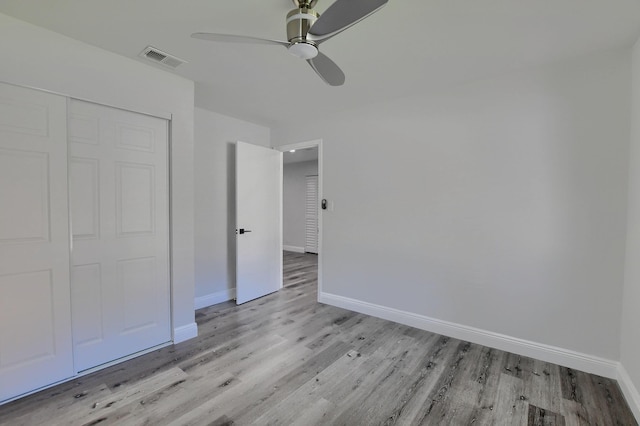 126 NW 3rd Ct, Boca Raton, FL 33432 - unfurnished bedroom with light wood-type flooring, baseboards, a closet, and a ceiling fan