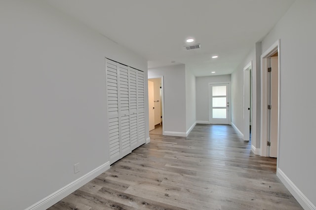 126 NW 3rd Ct, Boca Raton, FL 33432 - corridor featuring light wood-type flooring, baseboards, and recessed lighting