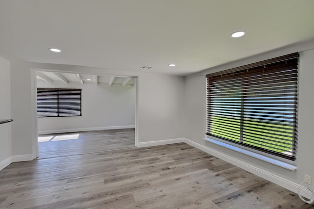126 NW 3rd Ct, Boca Raton, FL 33432 - unfurnished room featuring recessed lighting, beam ceiling, baseboards, and light wood-style flooring