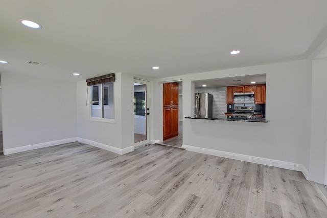 126 NW 3rd Ct, Boca Raton, FL 33432 - unfurnished living room featuring light wood-type flooring, recessed lighting, and baseboards