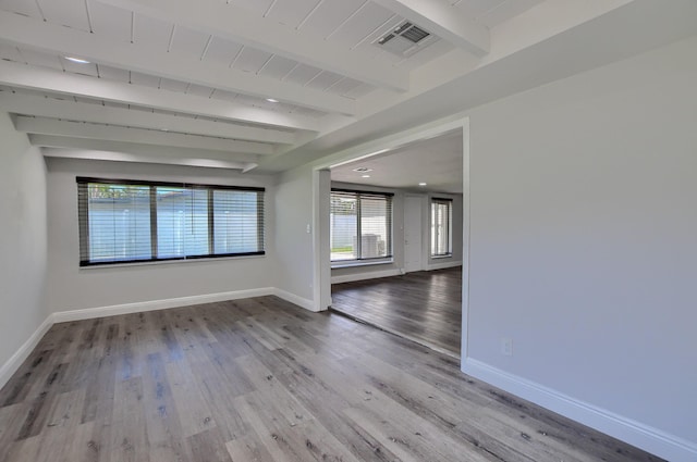 126 NW 3rd Ct, Boca Raton, FL 33432 - empty room with beamed ceiling, baseboards, and wood finished floors