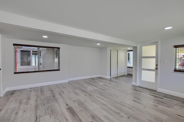 126 NW 3rd Ct, Boca Raton, FL 33432 - spare room featuring light wood-style floors, recessed lighting, plenty of natural light, and baseboards