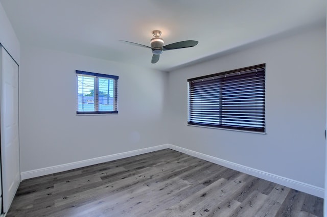 126 NW 3rd Ct, Boca Raton, FL 33432 - unfurnished room featuring a ceiling fan, wood finished floors, and baseboards