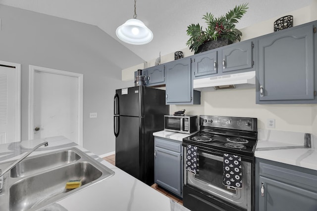1352 SW Halford Ave, Port Saint Lucie, FL 34953 - kitchen with under cabinet range hood, a sink, black appliances, lofted ceiling, and light countertops