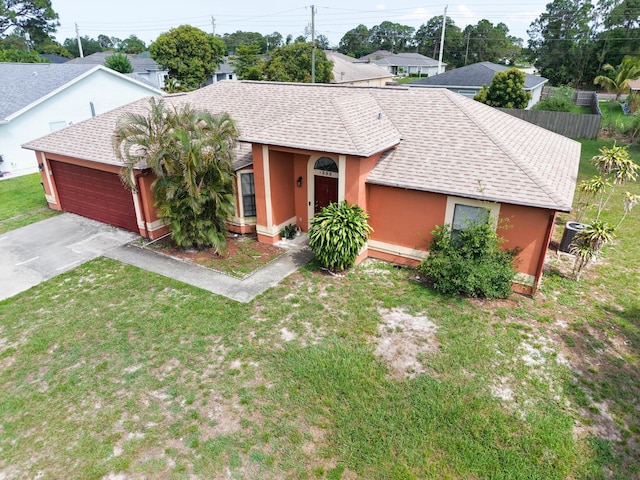 1352 SW Halford Ave, Port Saint Lucie, FL 34953 - single story home featuring an attached garage, a shingled roof, stucco siding, driveway, and a front yard