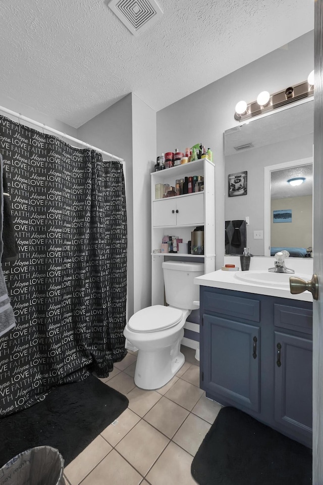 1352 SW Halford Ave, Port Saint Lucie, FL 34953 - full bath with toilet, tile patterned floors, vanity, a textured ceiling, and a shower with curtain
