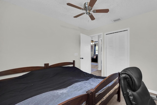 1352 SW Halford Ave, Port Saint Lucie, FL 34953 - carpeted bedroom with a textured ceiling, a closet, a ceiling fan, and baseboards