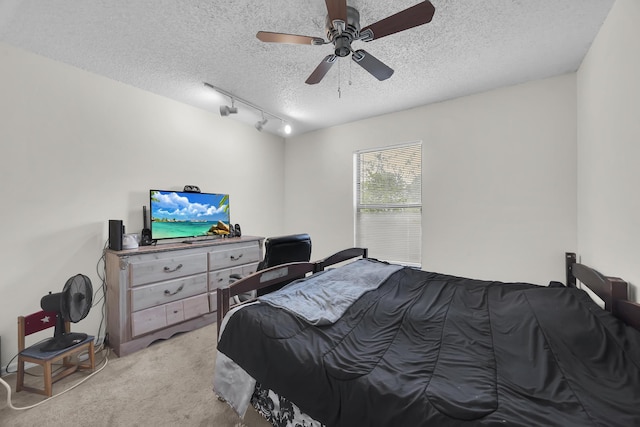 1352 SW Halford Ave, Port Saint Lucie, FL 34953 - bedroom with a textured ceiling, light colored carpet, track lighting, and a ceiling fan