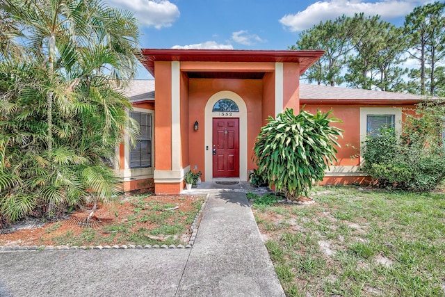 1352 SW Halford Ave, Port Saint Lucie, FL 34953 - entrance to property with stucco siding and roof with shingles