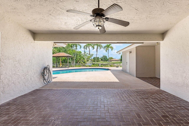9085 Talway Cir, Boynton Beach, FL 33472 - outdoor pool with a gazebo, a ceiling fan, and a patio