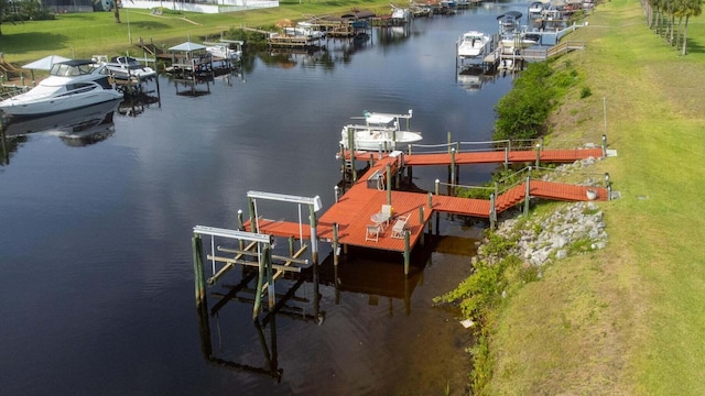 2608 SW River Shore Dr, Port Saint Lucie, FL 34984 - dock with boat lift and a water view