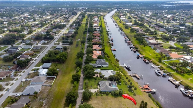 2608 SW River Shore Dr, Port Saint Lucie, FL 34984 - aerial overview of property's location featuring a nearby body of water and nearby suburban area