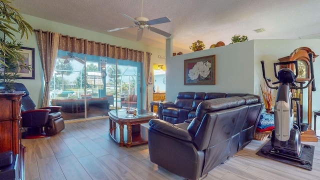 2608 SW River Shore Dr, Port Saint Lucie, FL 34984 - living room with wood finished floors, ceiling fan, and a textured ceiling
