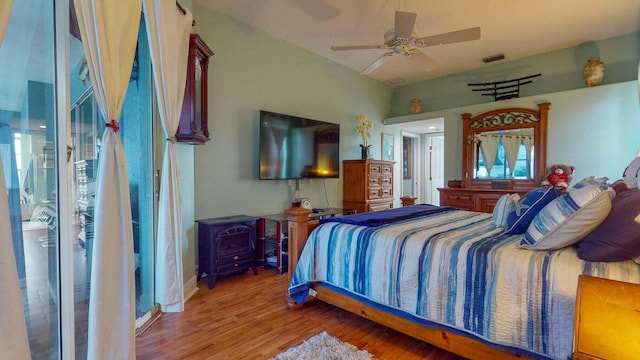 2608 SW River Shore Dr, Port Saint Lucie, FL 34984 - bedroom with wood finished floors and a ceiling fan