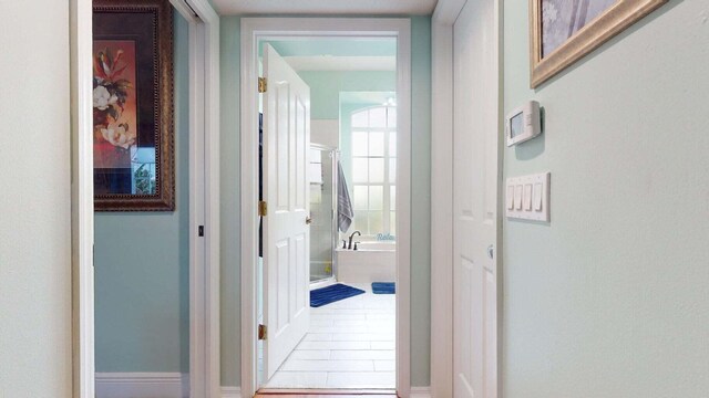 2608 SW River Shore Dr, Port Saint Lucie, FL 34984 - corridor featuring baseboards