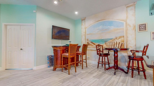 2608 SW River Shore Dr, Port Saint Lucie, FL 34984 - indoor dry bar featuring wood finished floors, baseboards, and recessed lighting