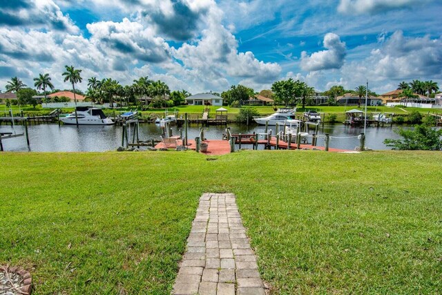 2608 SW River Shore Dr, Port Saint Lucie, FL 34984 - dock area featuring a yard and a water view