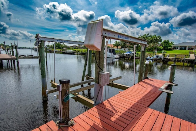 2608 SW River Shore Dr, Port Saint Lucie, FL 34984 - dock with boat lift and a water view