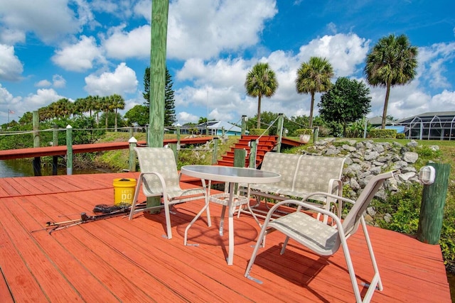 2608 SW River Shore Dr, Port Saint Lucie, FL 34984 - wooden terrace featuring outdoor dining area