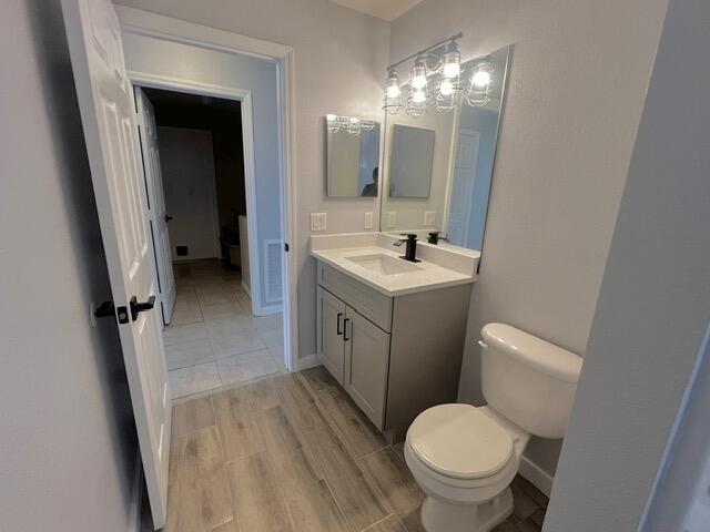 8065 99th Ct, Vero Beach, FL 32967 - bathroom with vanity and wood finished floors