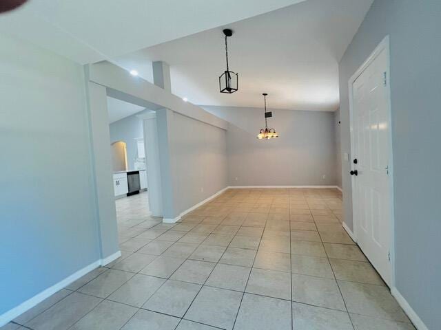 8065 99th Ct, Vero Beach, FL 32967 - unfurnished room featuring light tile patterned flooring and a chandelier