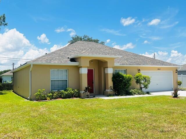 8065 99th Ct, Vero Beach, FL 32967 - ranch-style house with stucco siding, a garage, a front yard, concrete driveway, and a shingled roof