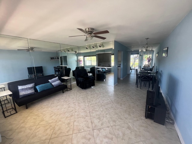 161 Dorset D, Boca Raton, FL 33434 - living room featuring ceiling fan, plenty of natural light, a chandelier, and light tile patterned flooring