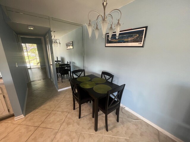 161 Dorset D, Boca Raton, FL 33434 - dining space with a chandelier, light tile patterned floors, and baseboards