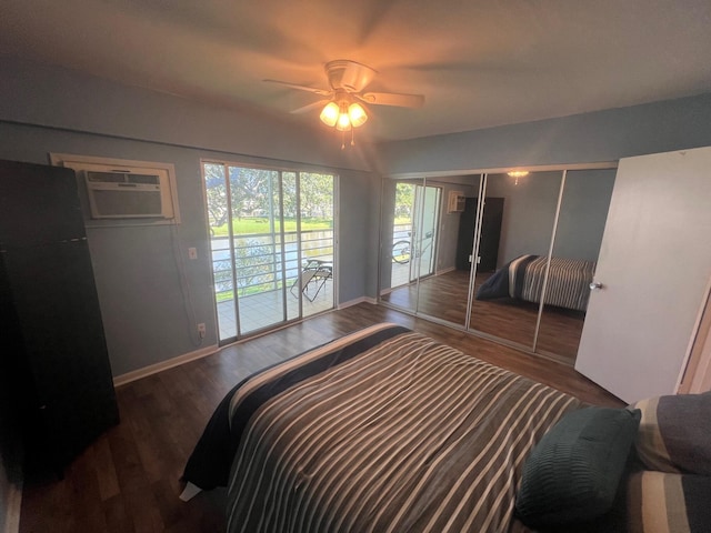 161 Dorset D, Boca Raton, FL 33434 - bedroom featuring access to outside, wood finished floors, baseboards, a wall mounted air conditioner, and a closet