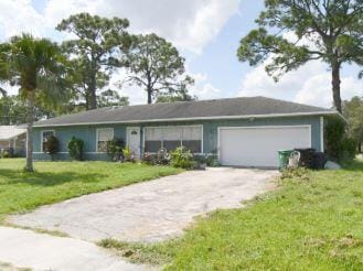 682 NW Cardinal Dr, Port Saint Lucie, FL 34983 - ranch-style home featuring driveway, a front yard, and a garage