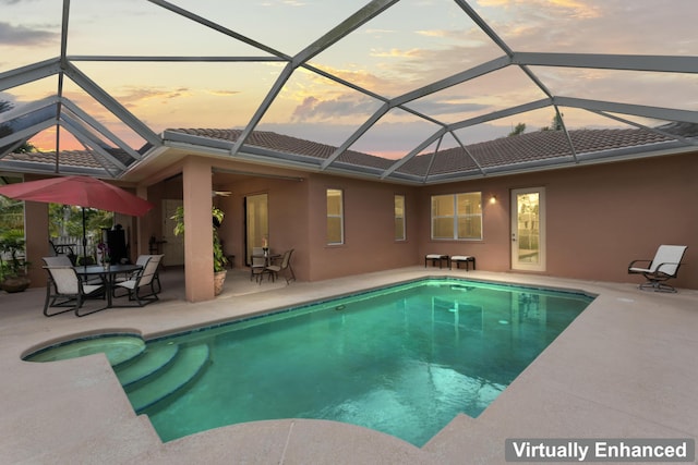 1992 SE Fairfield St, Port Saint Lucie, FL 34983 - pool at dusk with an outdoor pool and a patio