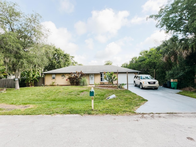 7810 Santa Clara Blvd, Fort Pierce, FL 34951 - ranch-style house with driveway and an attached garage